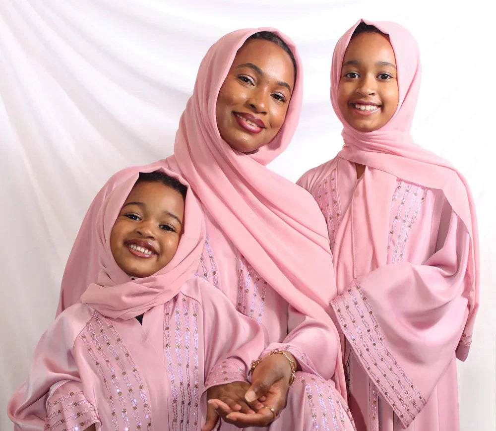 Mother and daughter wearing elegant coordinated Eid outfits from Elegance Galleria