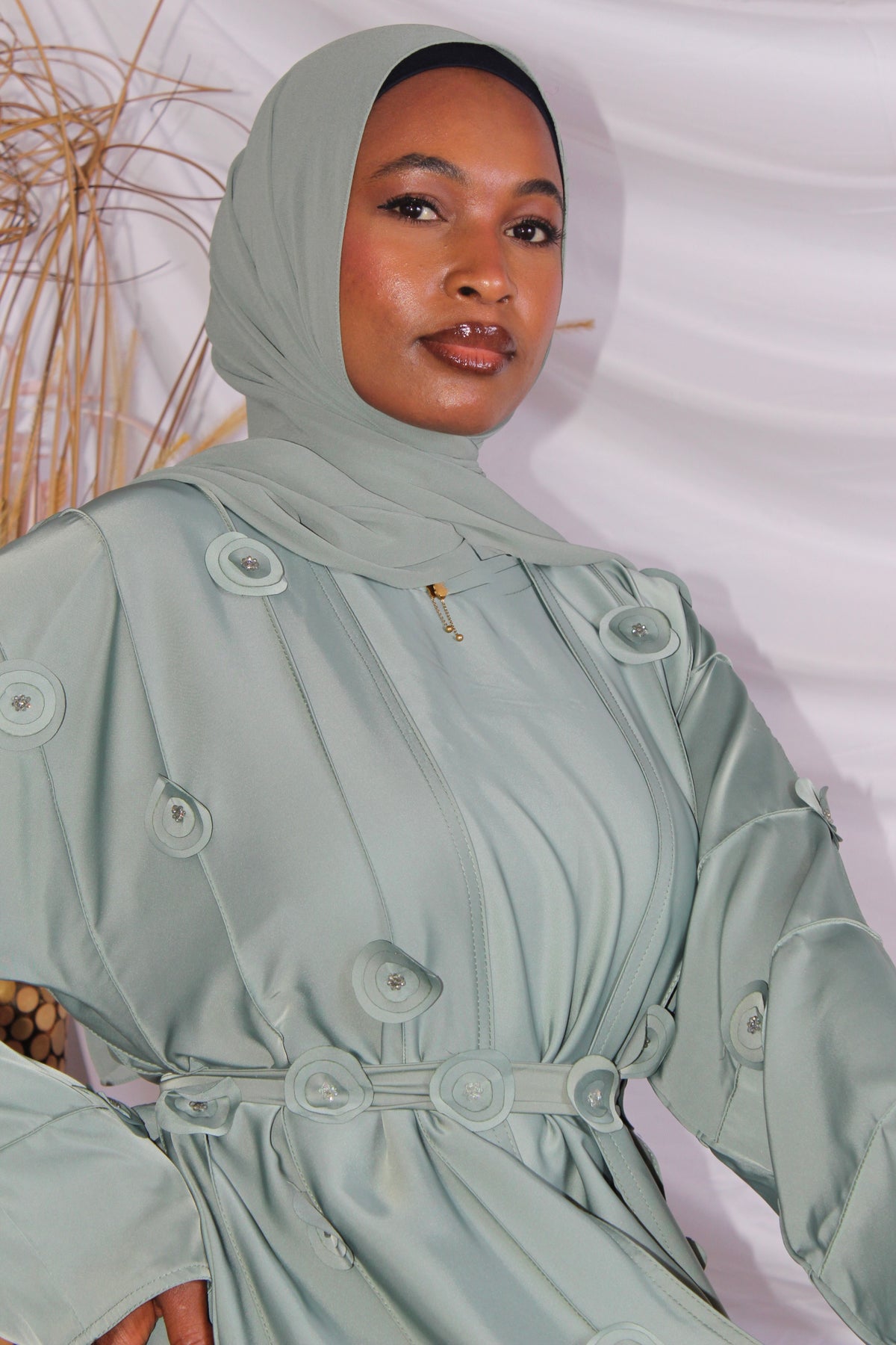 Close-up of floral handwork on Bushra Sula fabric