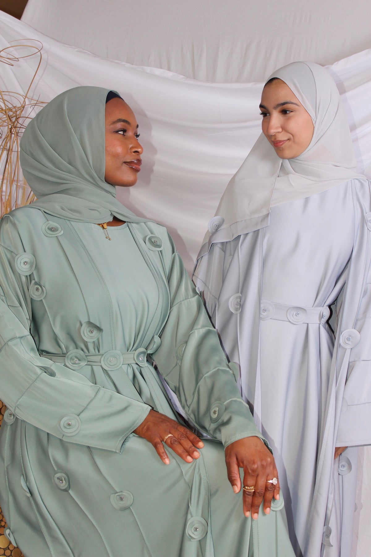 Elegant Bushra modest abaya with floral detailing and a flowing fit