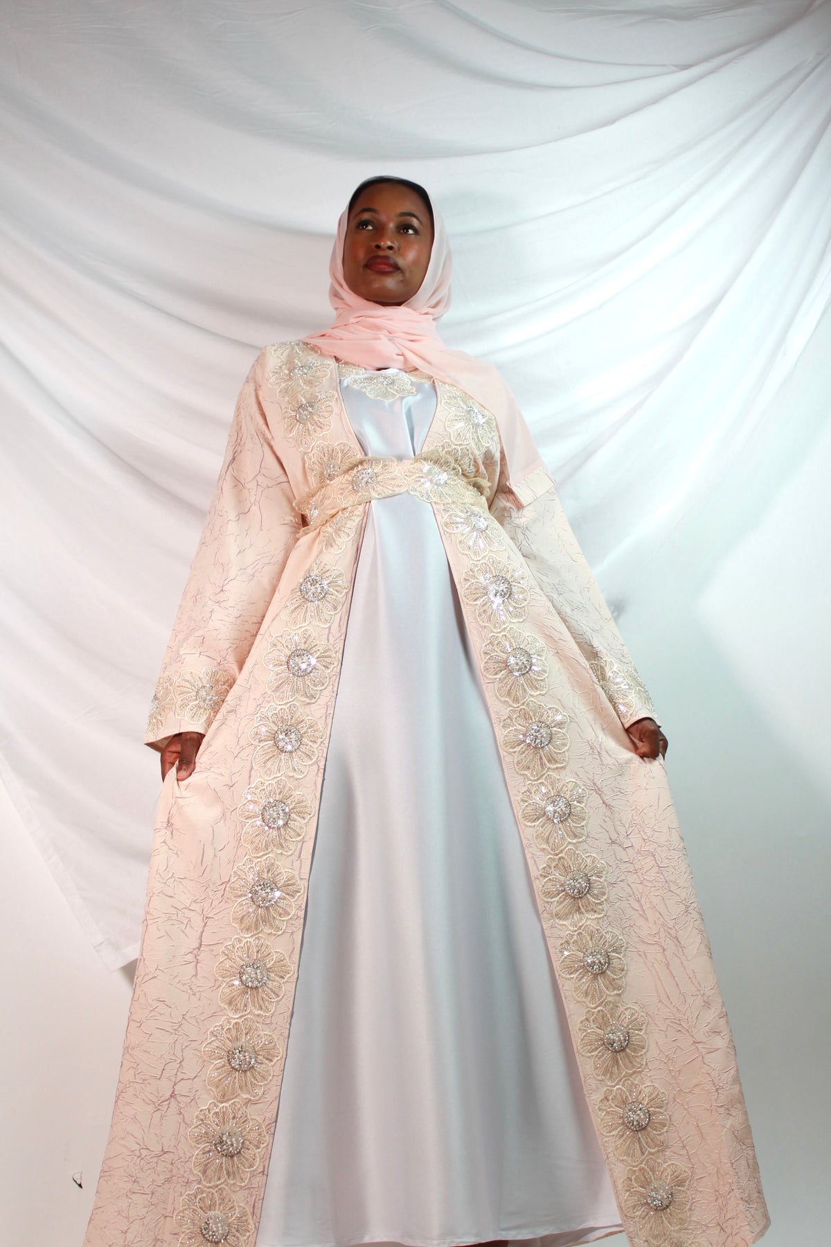 Floral embroidery detail along the front panels of Rosa kaftan