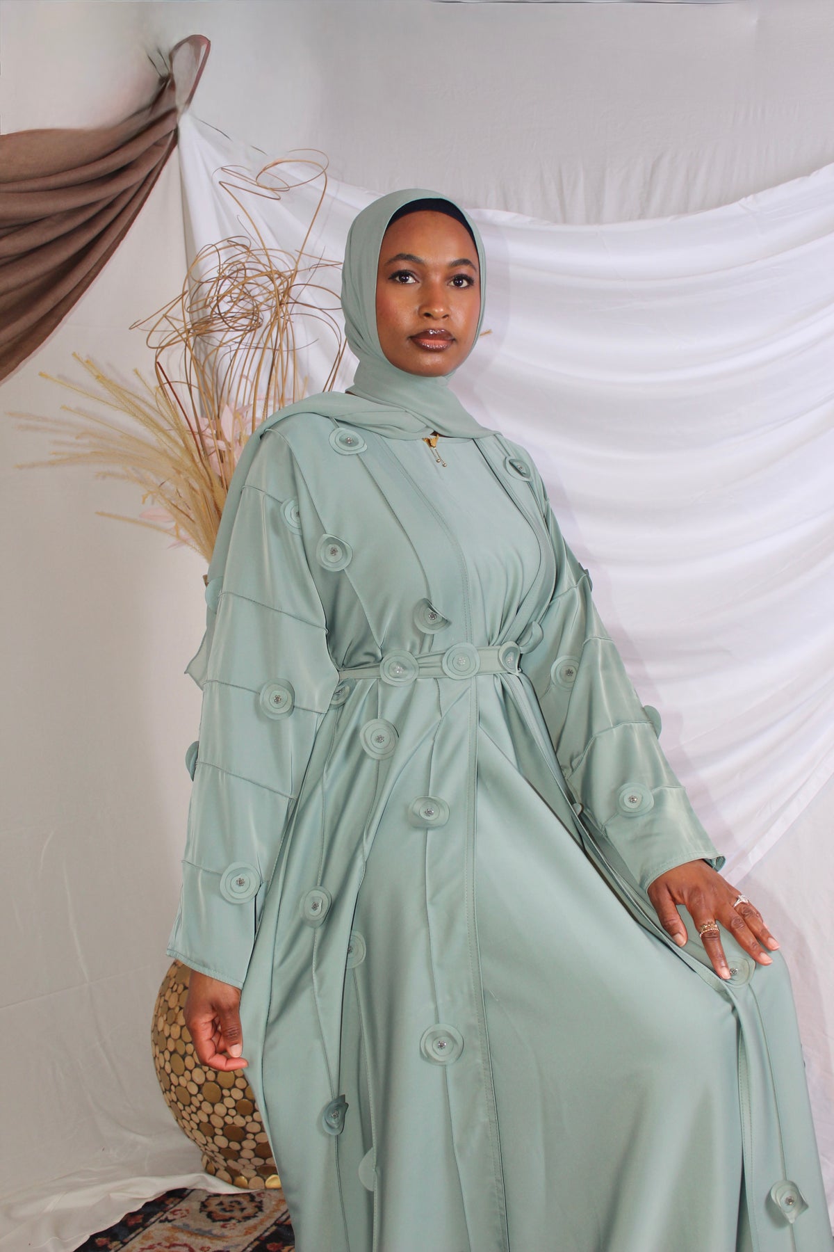 Bushra flowing abaya coat with a graceful modest silhouette