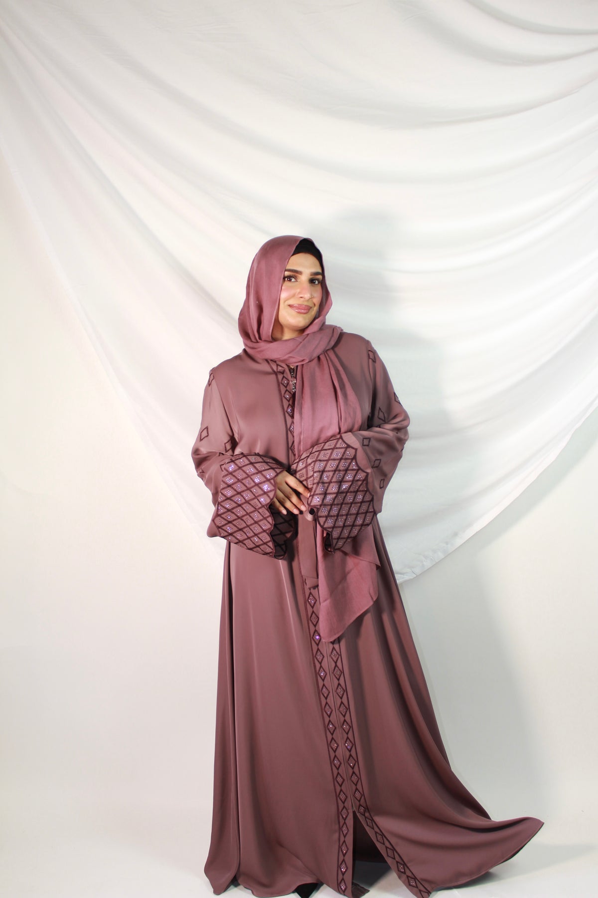 Close-up of delicate embroidery on Mahnoor abaya fabric